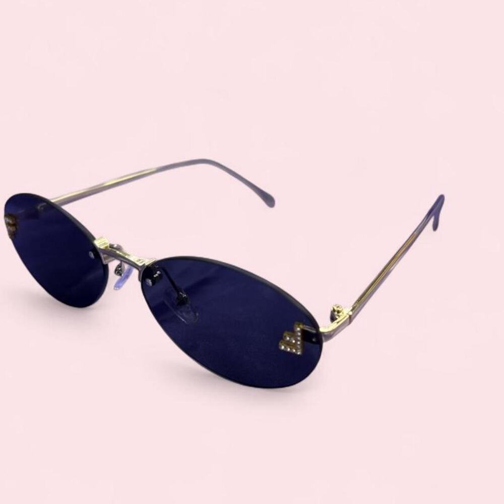 Vintage-inspired oval sunglasses dark lenses and gold hardware y2k mcbling